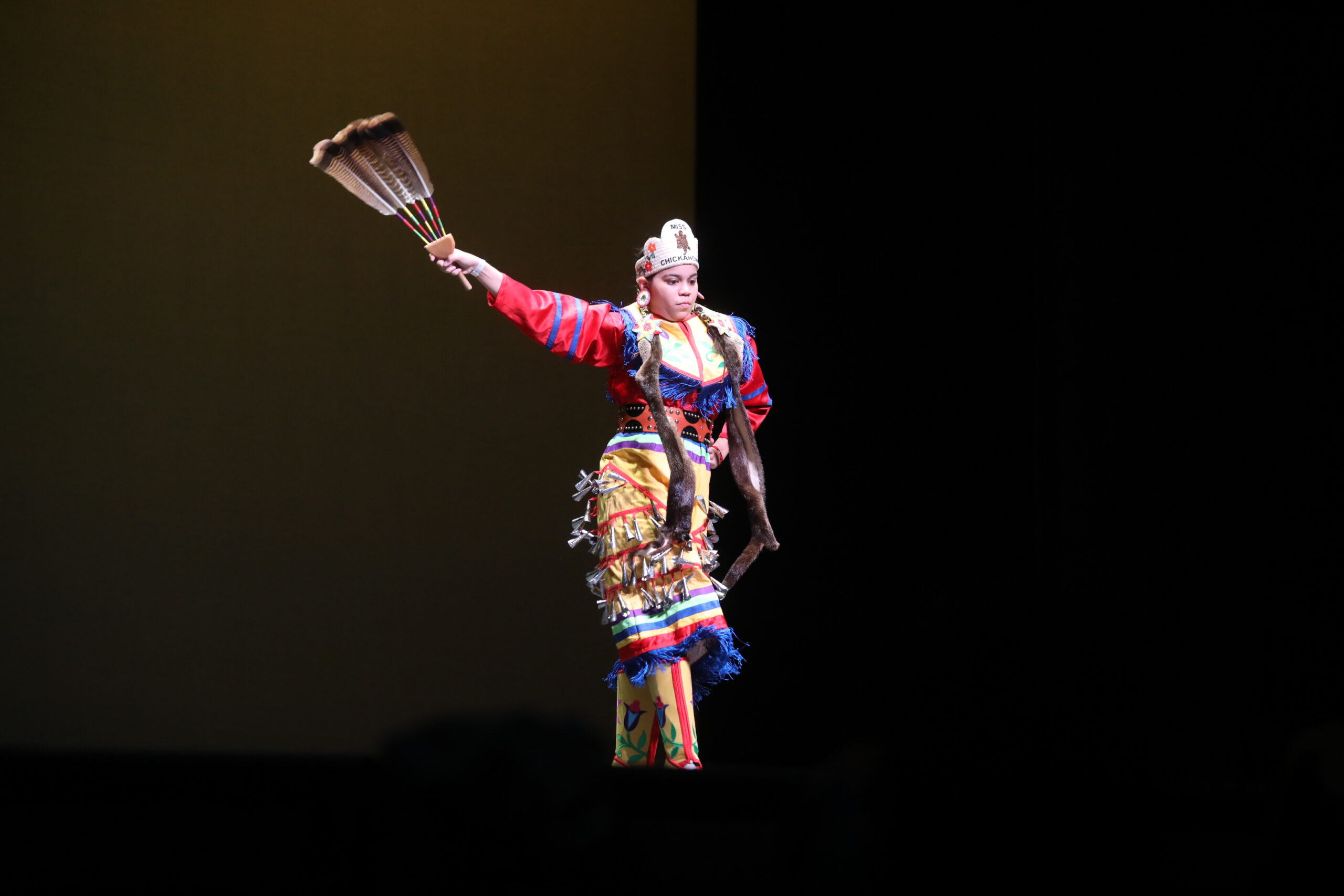 A student performing their traditional dance.